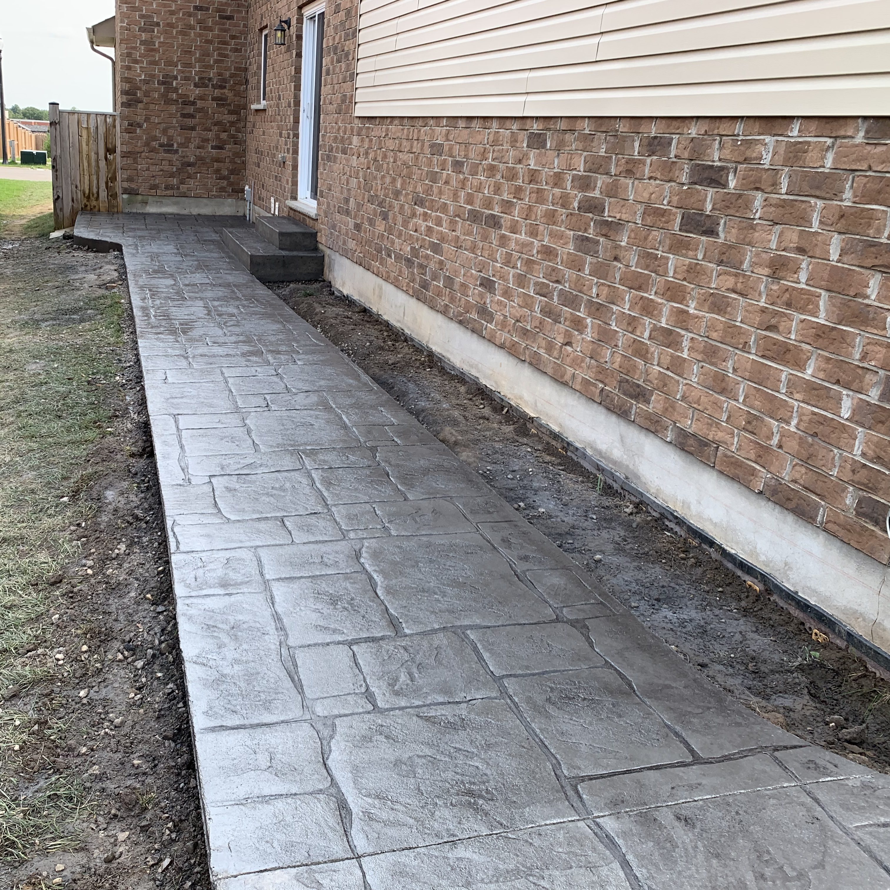 English Yorkstone Stamped Concrete Walkway in Thorndale Ontario