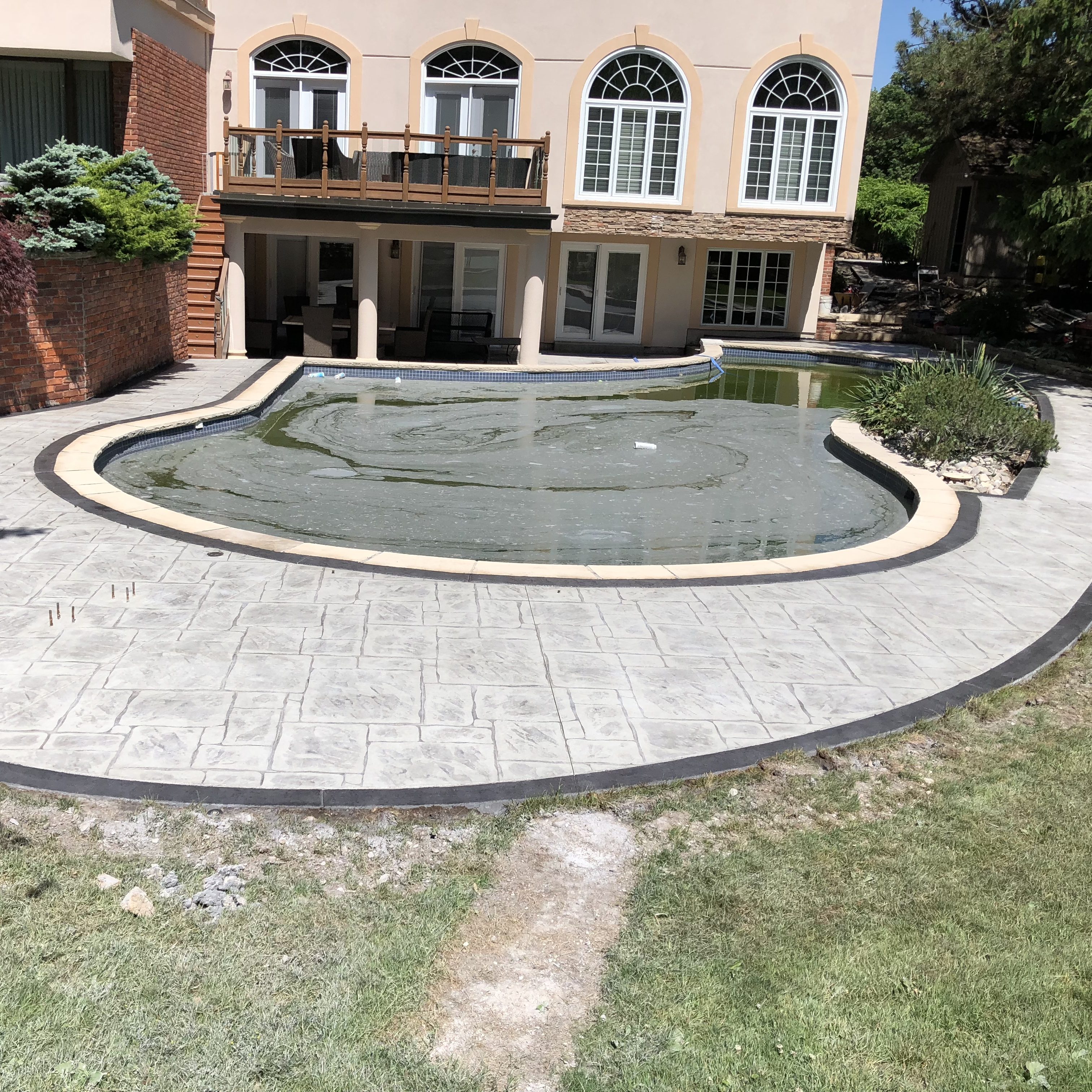 English Yorkstone Stamped Concrete Pool Deck with Separately Poured Border in London Ontario