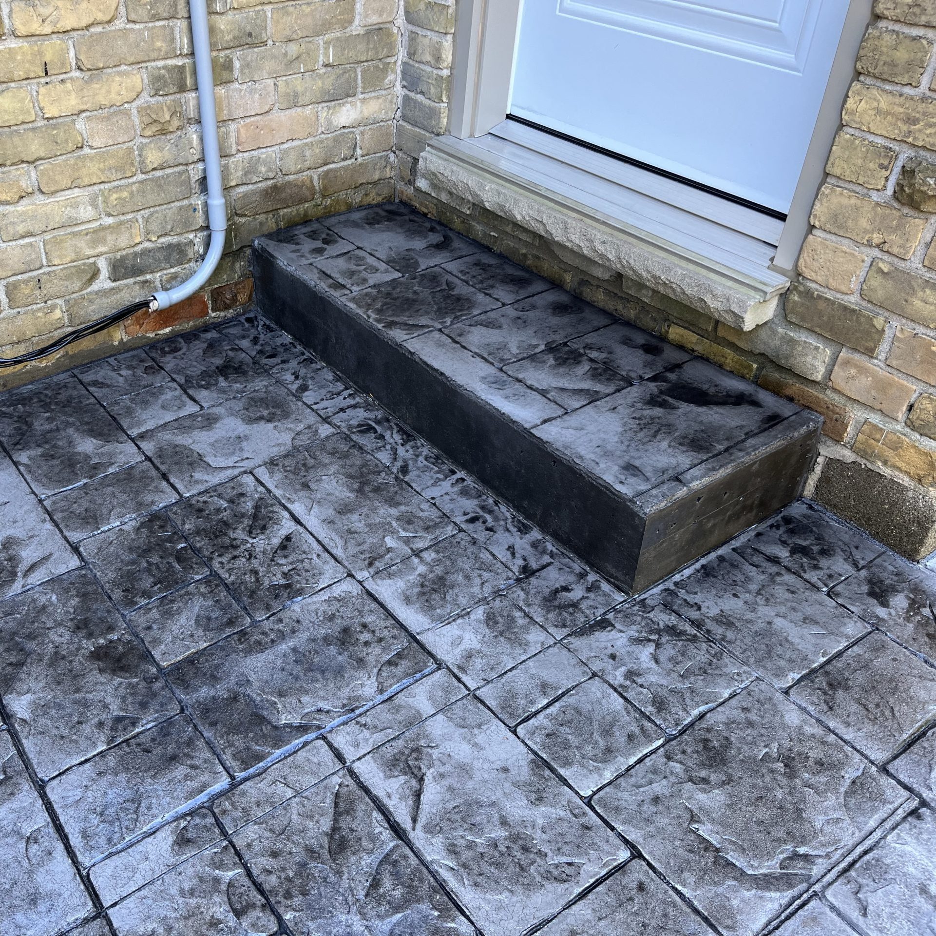 Small Ashlar Slate Stamped Concrete Step in London Ontario