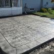 Small Ashlar Stamped Concrete Patio with Stone Block Border in Mitchell Ontario